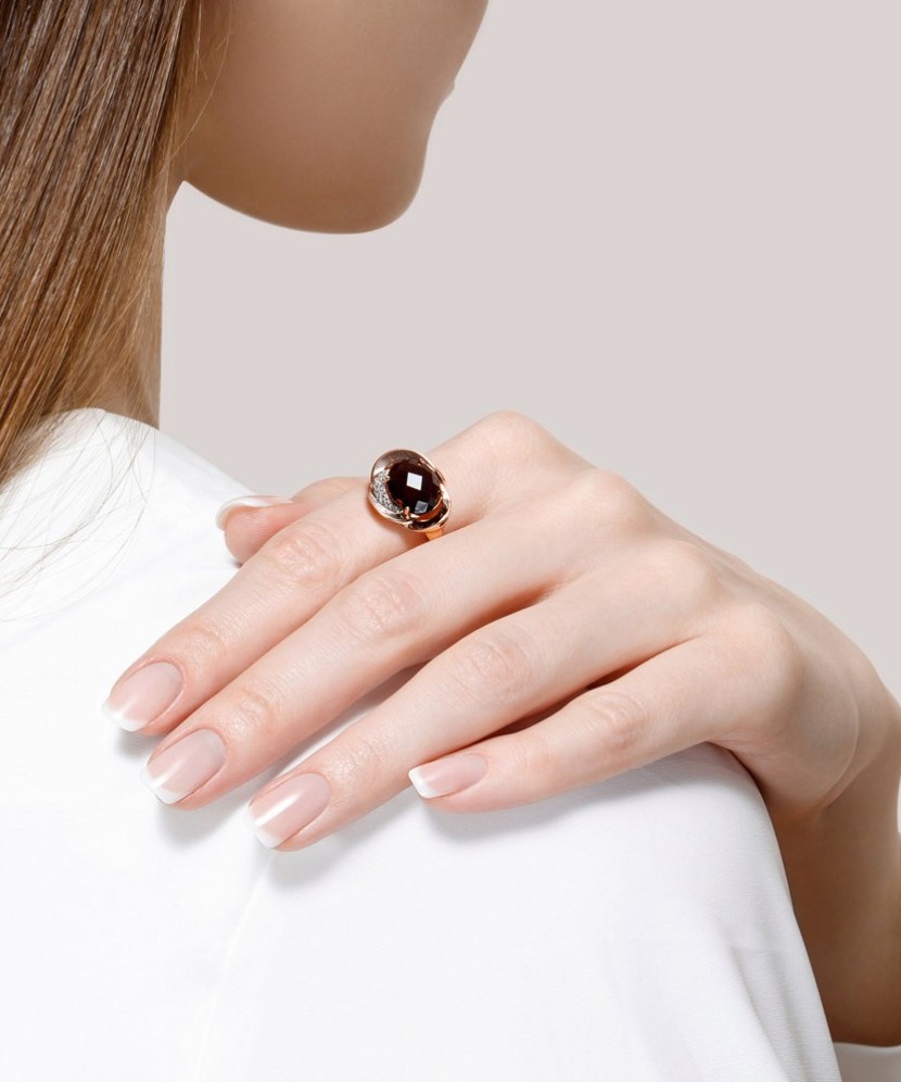 Gold ring with smoky topaz and zircons