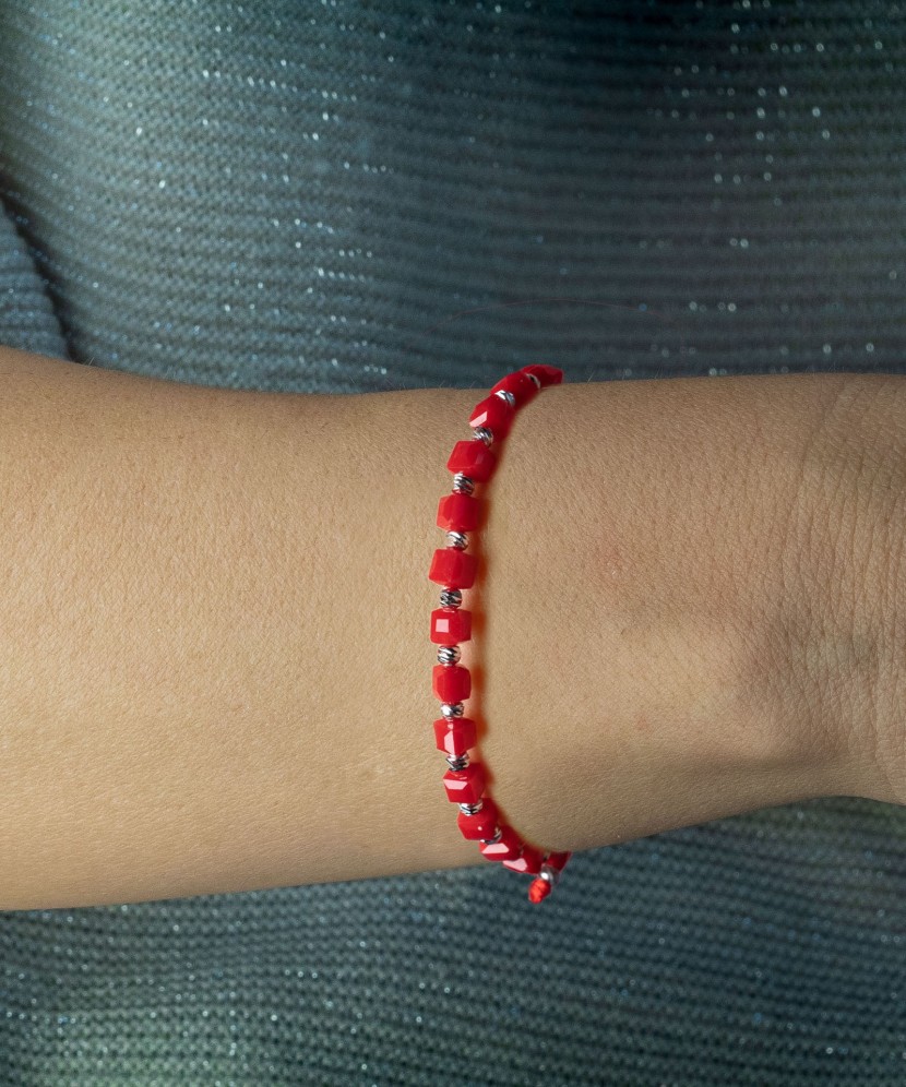 Red string bracelet with silver and onyxes