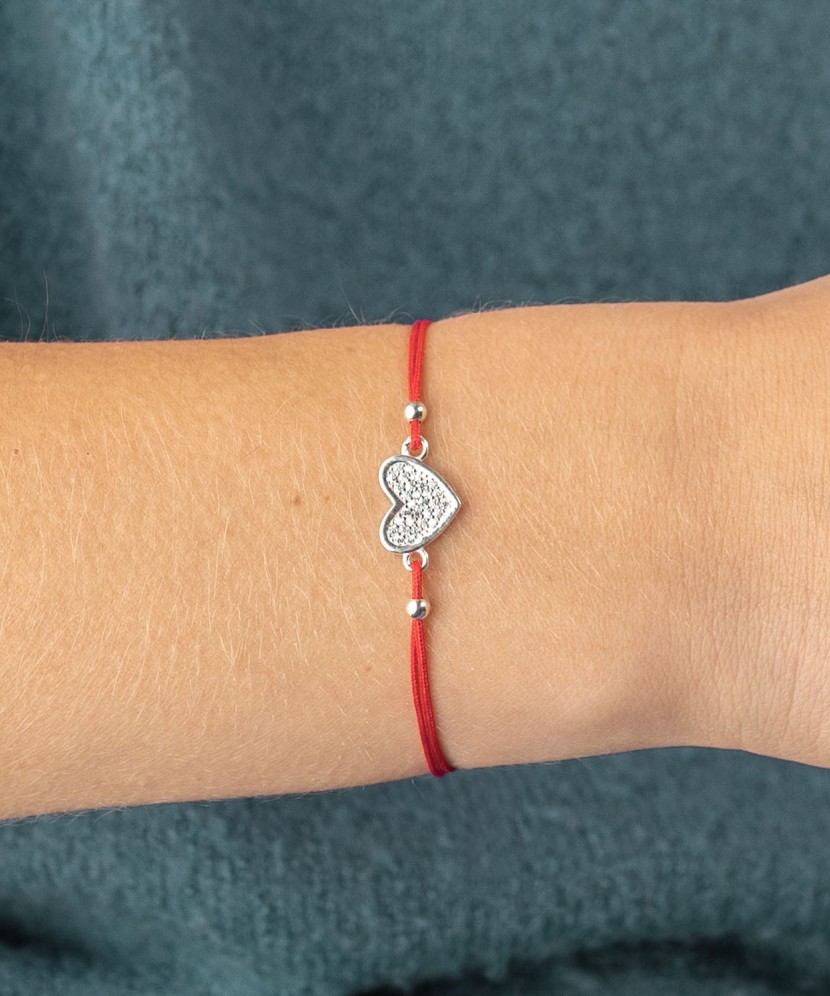 Red string bracelet with a silver pendant "Heart"