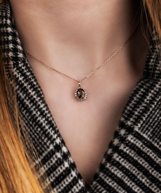 Gold pendant with diamonds and smoky quartz