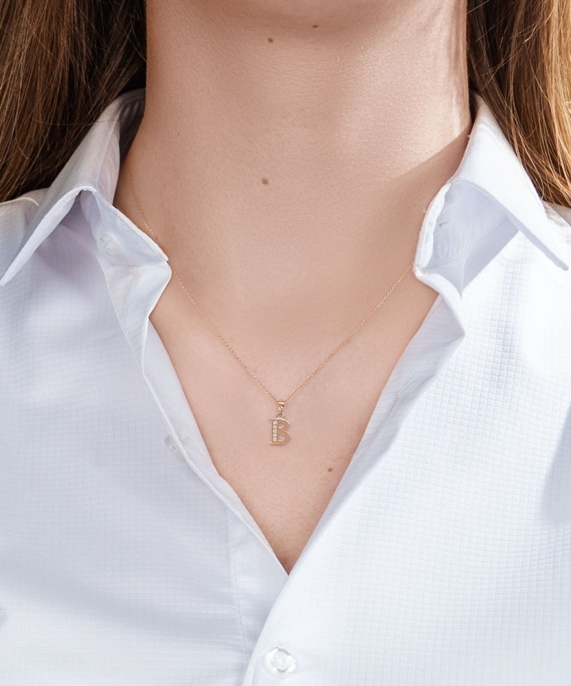 Gold pendant with zircons Letter B