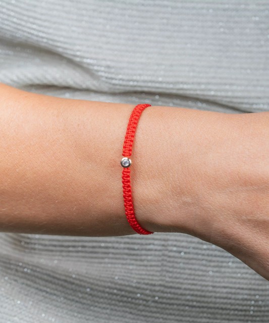Red string bracelet with gold zirconia pendant