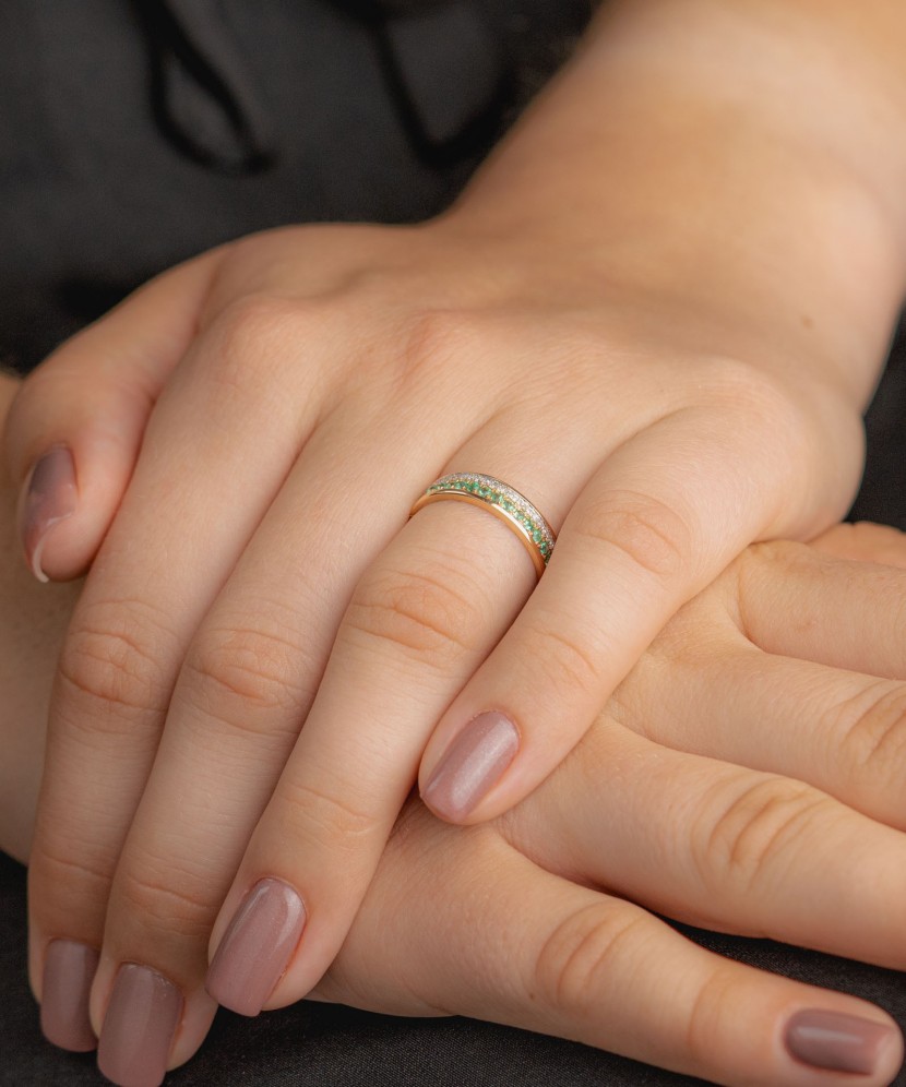 Gold ring with diamonds and emeralds