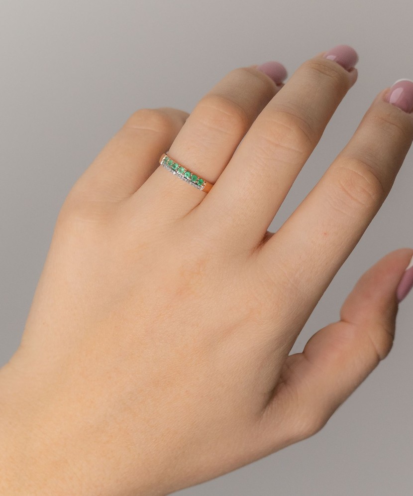 Gold ring with emeralds and diamonds