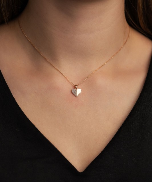 Gold pendant with zircons "heart"