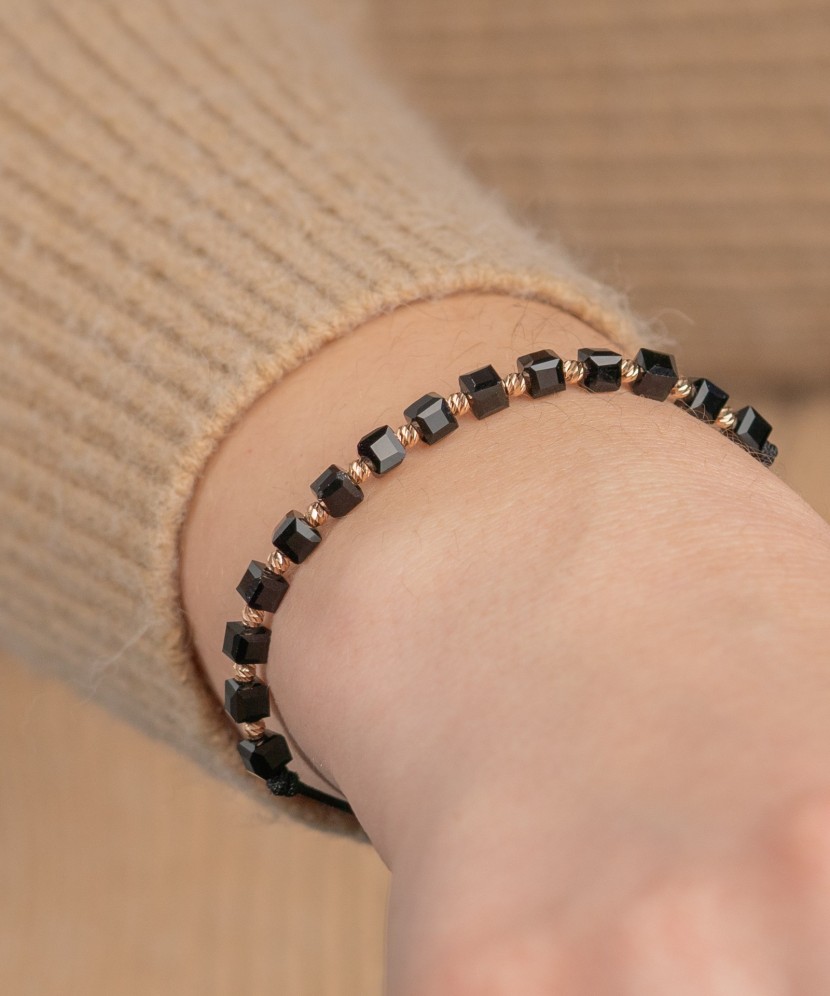 Black string bracelet with gold and onyxes