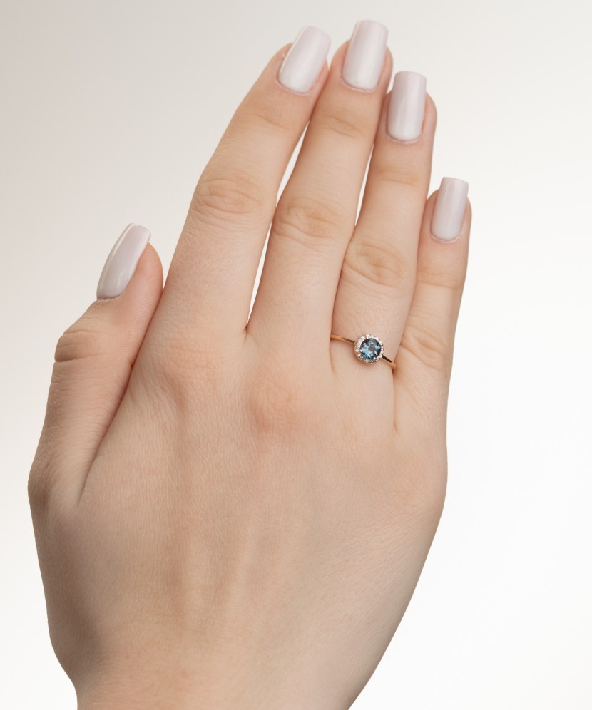 Gold ring with diamonds and London topaz