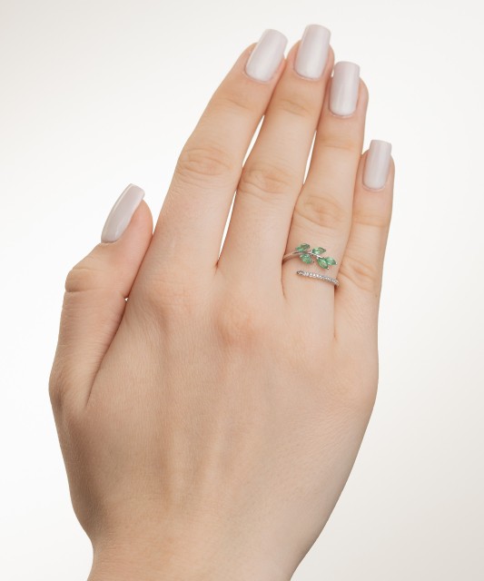 White gold ring with diamonds and emeralds