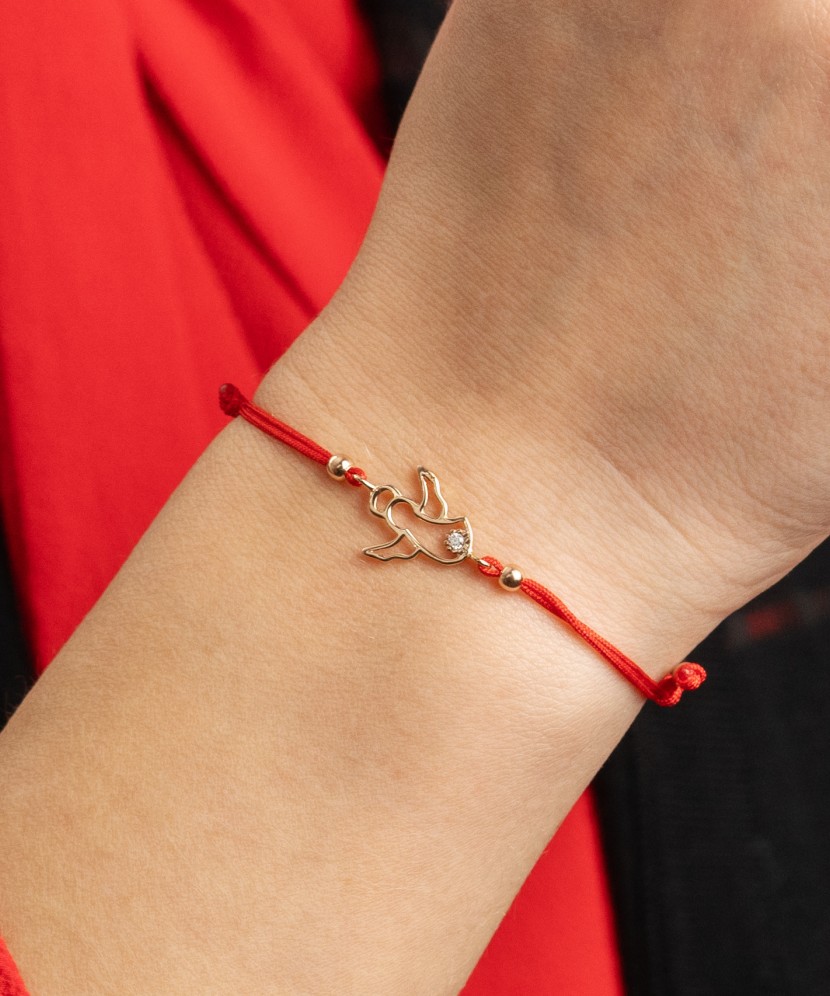 Red string bracelet with gold pendant "angel"