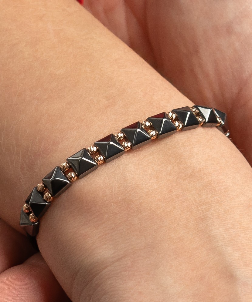 Black string bracelet with gold And Hematites