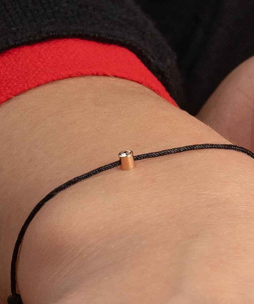 Black string bracelet white gold and diamond pendant 0.03ct