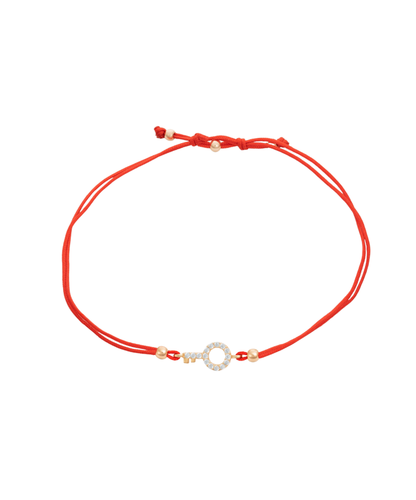 Red string bracelet with a gold pendant and zirconium