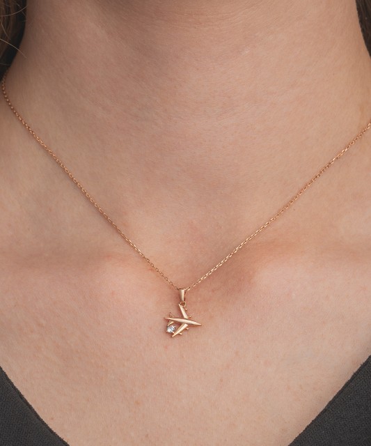 Gold pendant with zircons