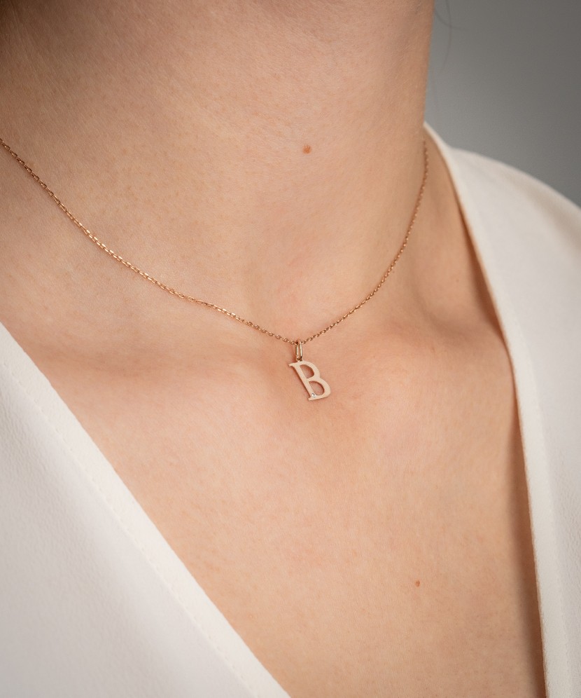 Gold pendant with diamond letter B