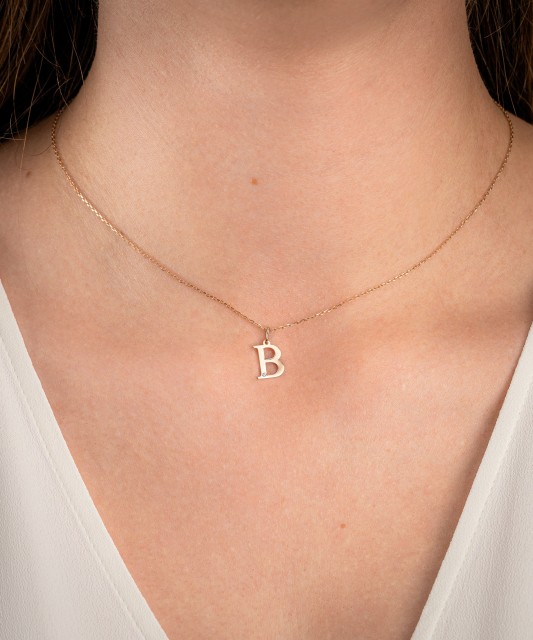 Gold pendant with diamond letter B