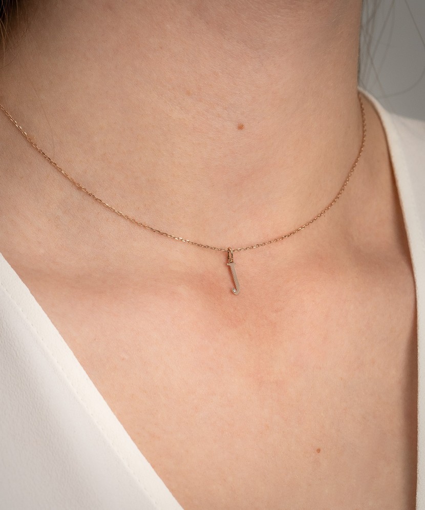 Gold pendant with diamond letter J