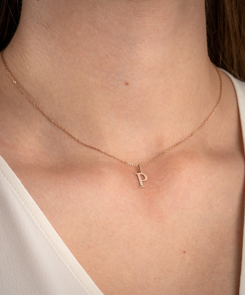 Gold pendant with diamond letter P