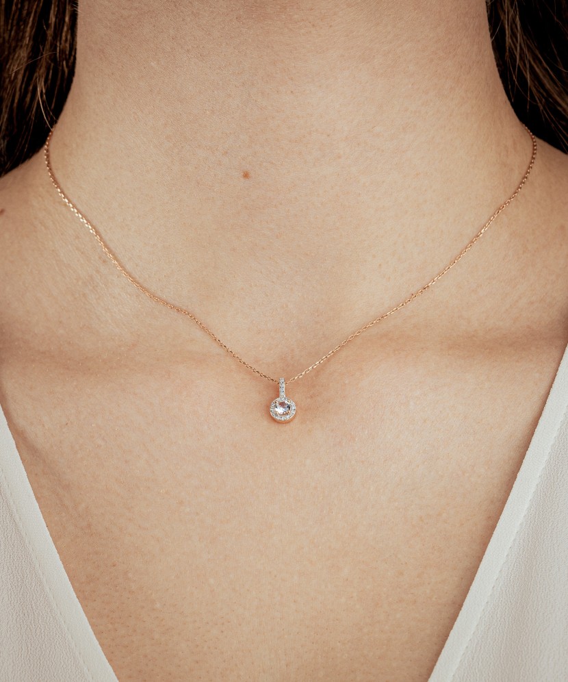 Gold pendant with diamonds and clear topaz