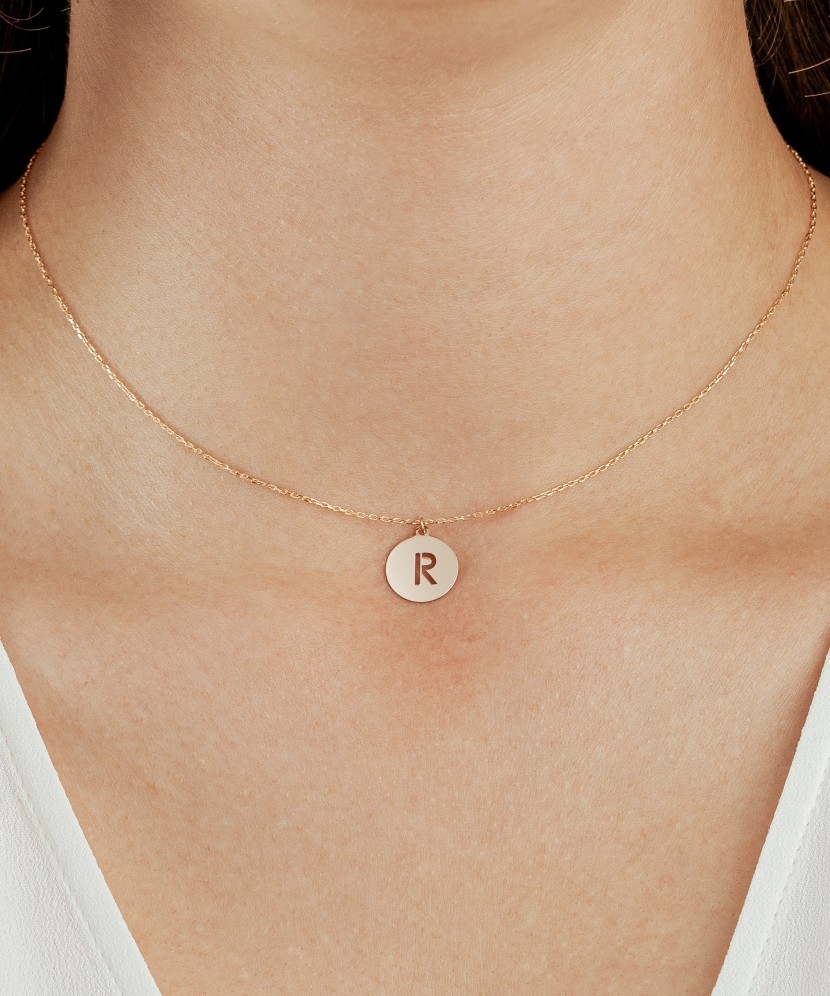 Gold chain with pendant letter R
