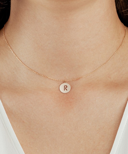 Gold chain with pendant letter R