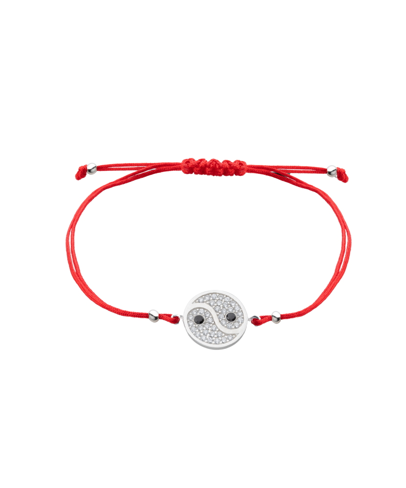 Red string bracelet with a silver pendant with zirconium