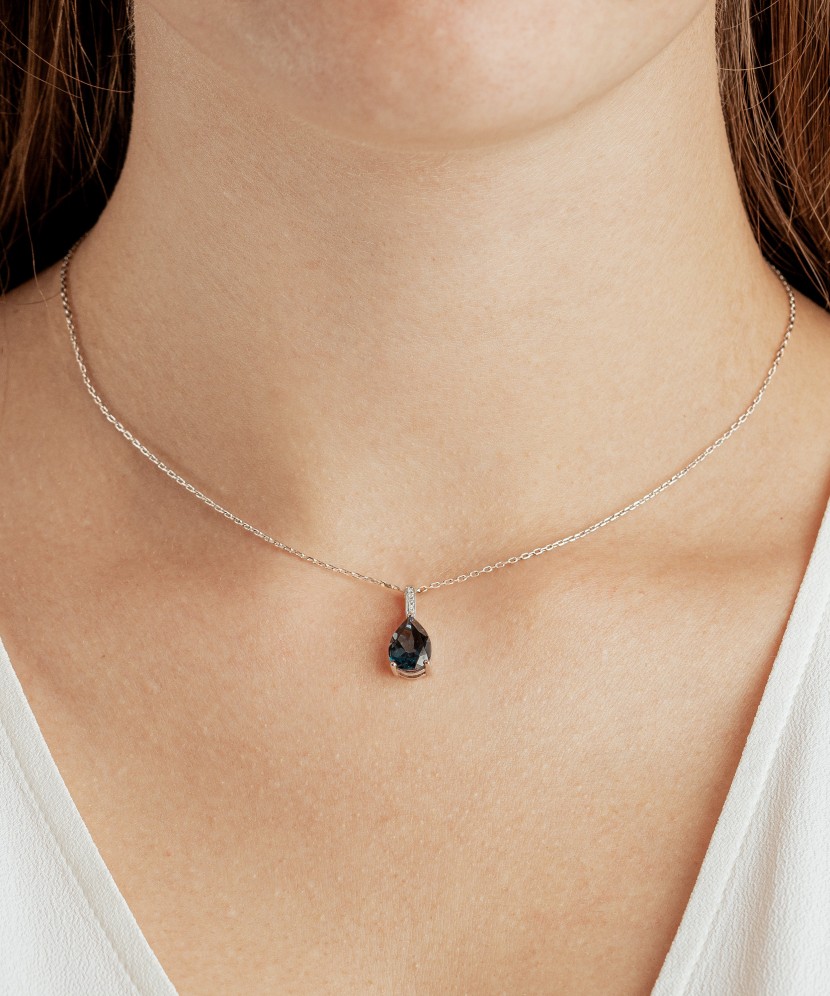 White gold pendant with diamonds and London topaz