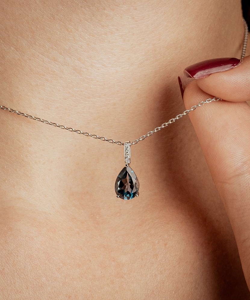 White gold pendant with diamonds and London topaz