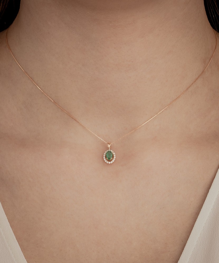 Gold chain with emerald and diamond pendant