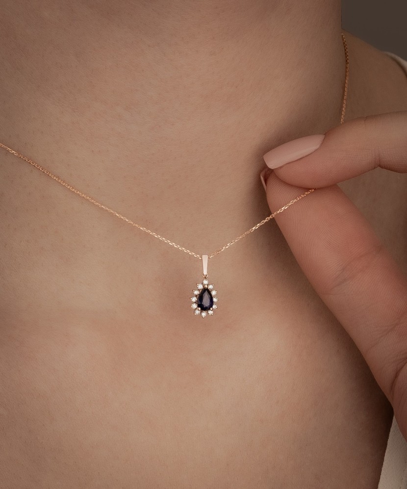 Gold chain with sapphire and diamond pendant