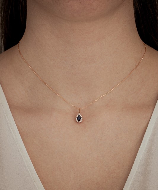 Gold chain with sapphire and diamond pendant