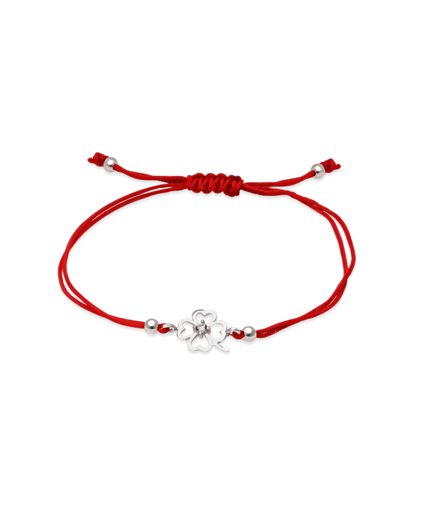 Red string bracelet with a silver pendant