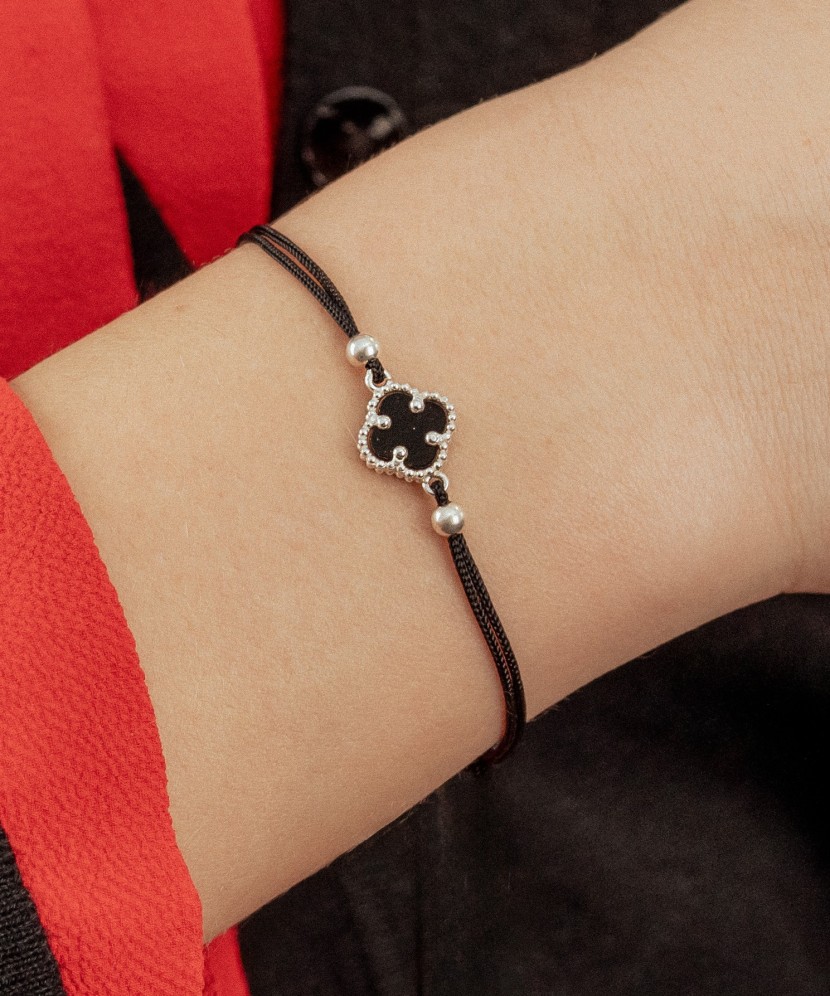 Black string bracelet with silver and onyxes