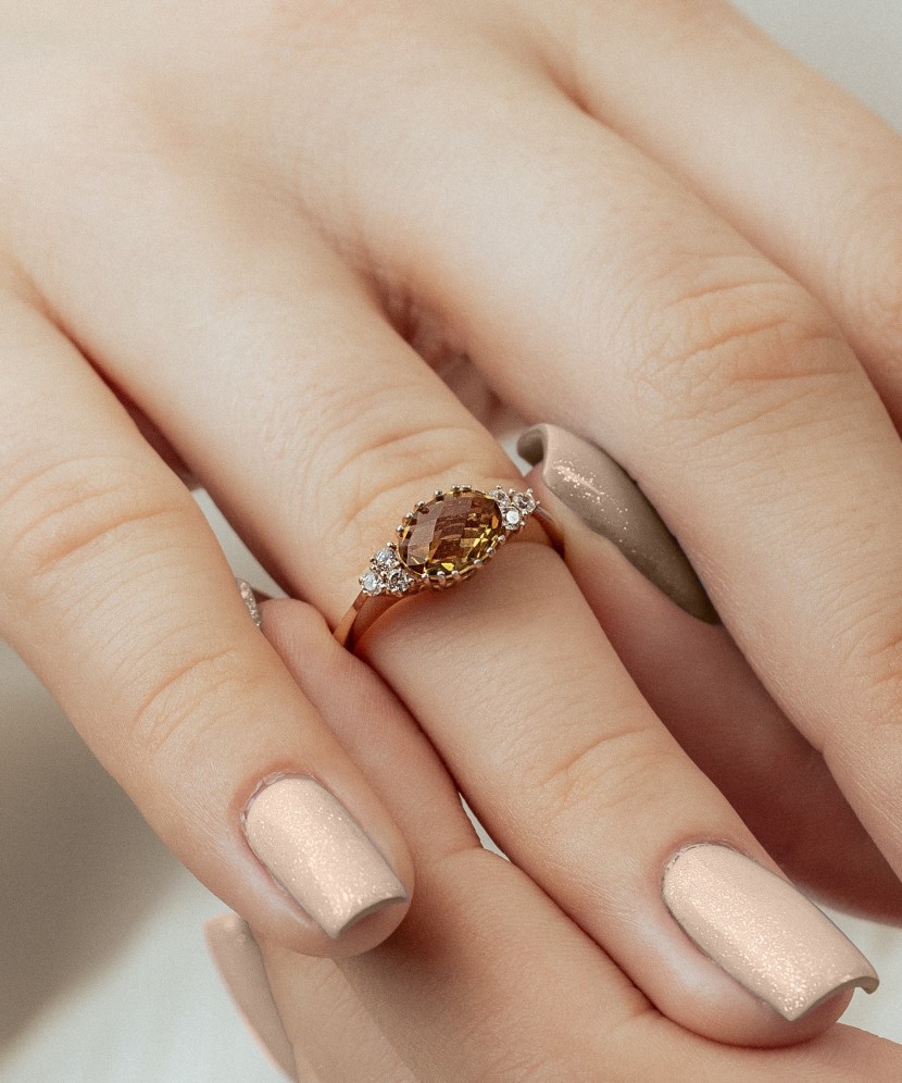 Gold ring with sultanite and zircons