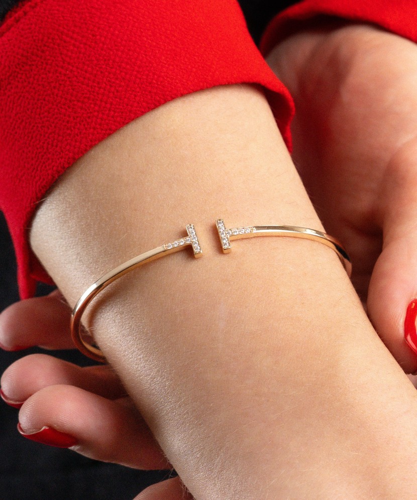 Gold hard bracelet with zircons