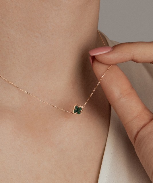 Gold necklace with a malachite pendant