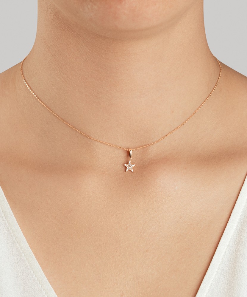 Gold pendant with zircons "star"