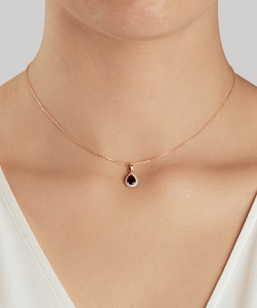 Gold pendant with zircons