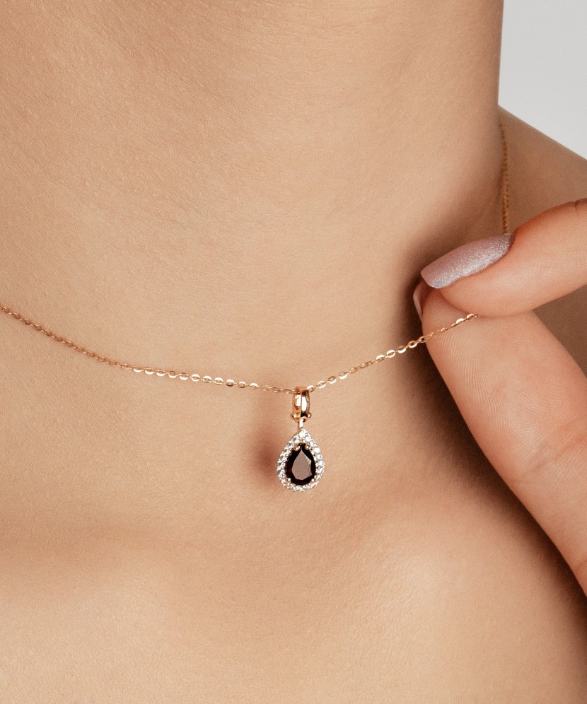 Gold pendant with zircons