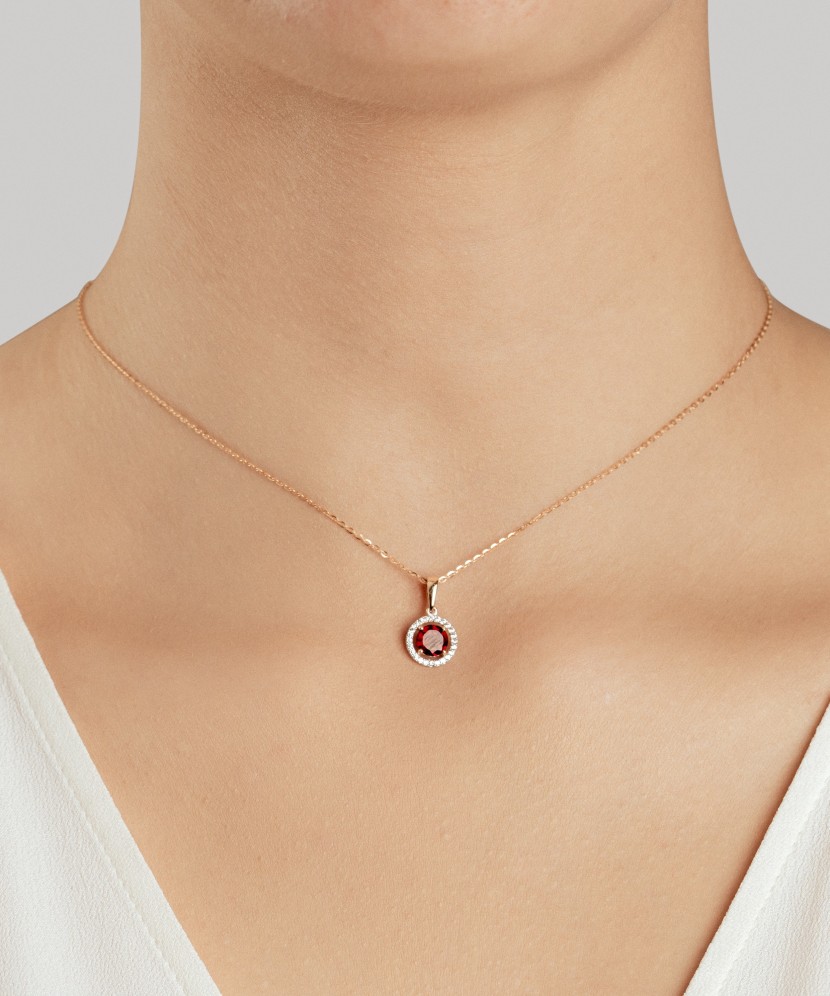 Gold pendant with zircons