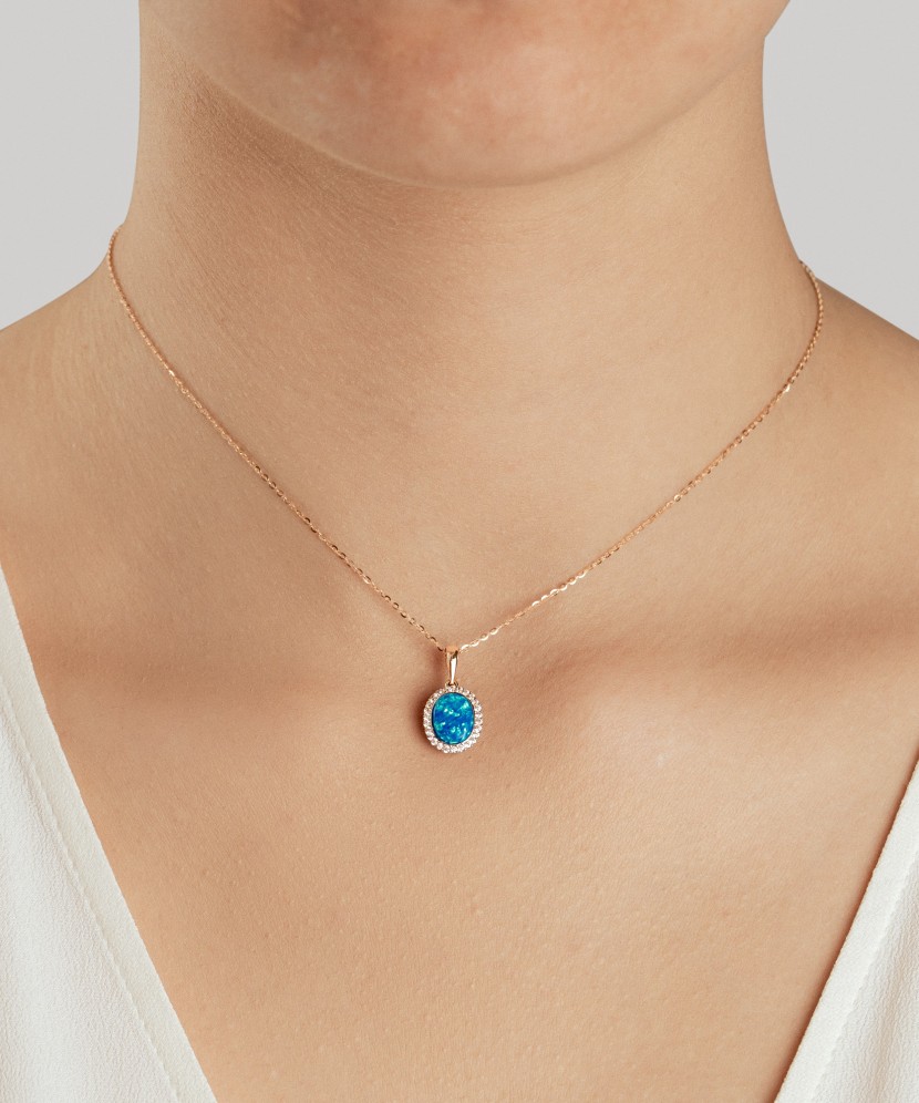 Gold pendant with opal and zircons