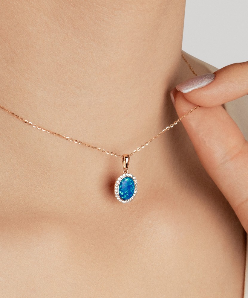 Gold pendant with opal and zircons