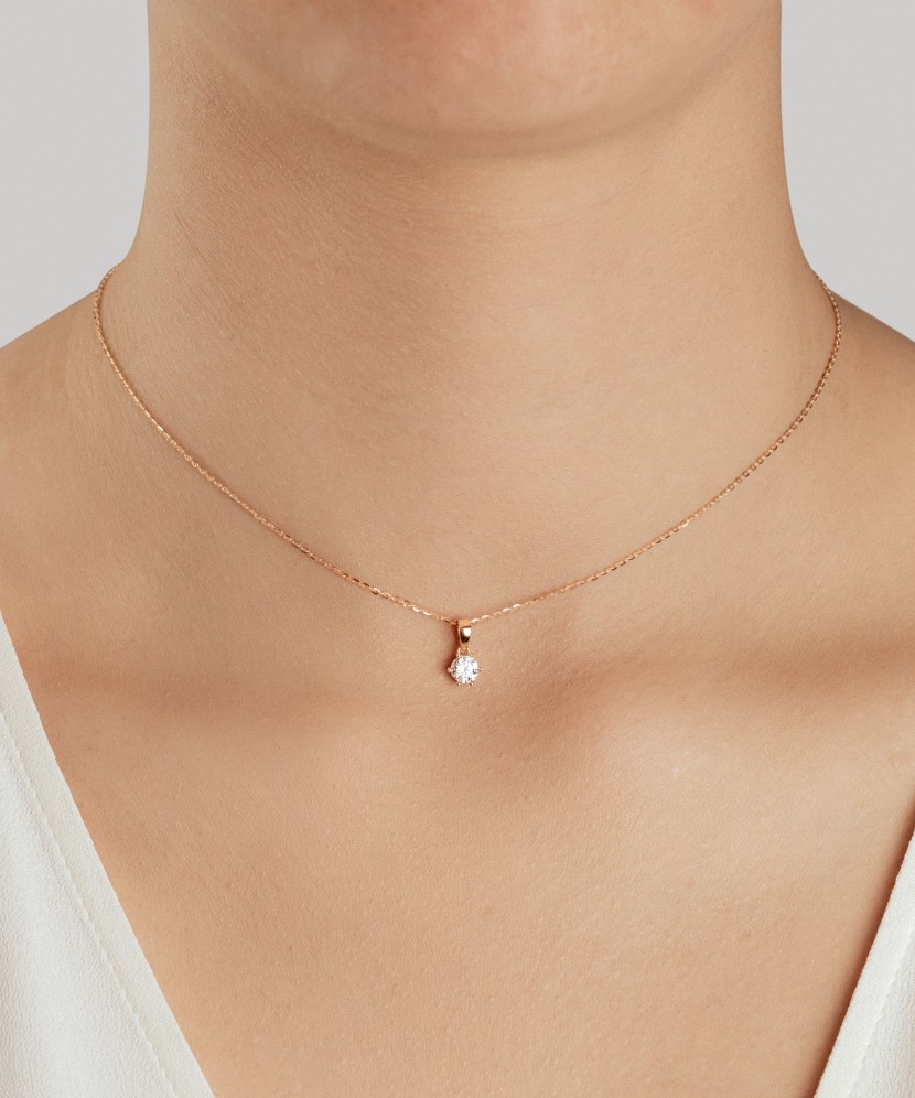 Gold pendant with zircons