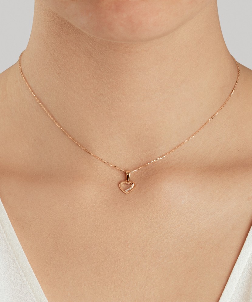 Gold pendant with zircons "heart"