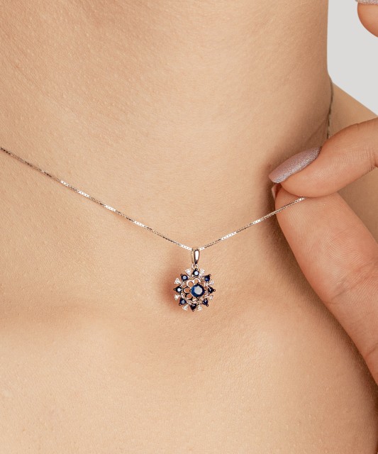 White gold pendant with diamonds and sapphires