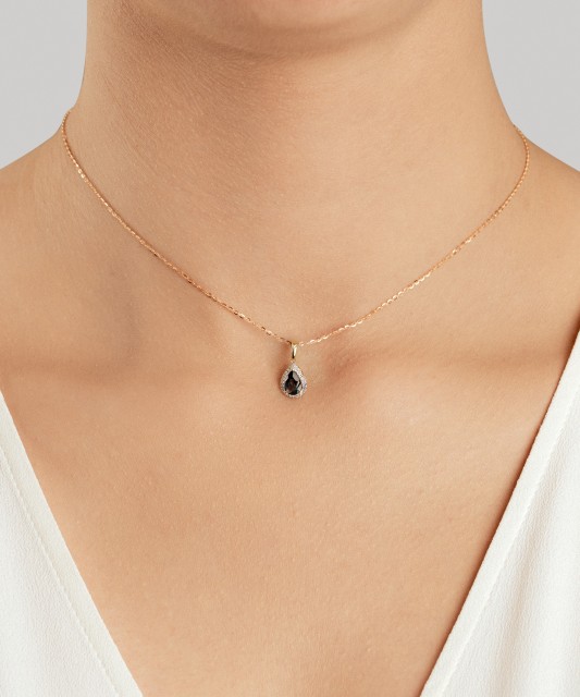 Yellow gold pendant with diamonds and London topaz