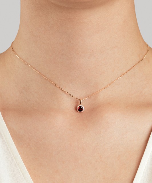 Gold pendant with garnet and diamonds "Heart"