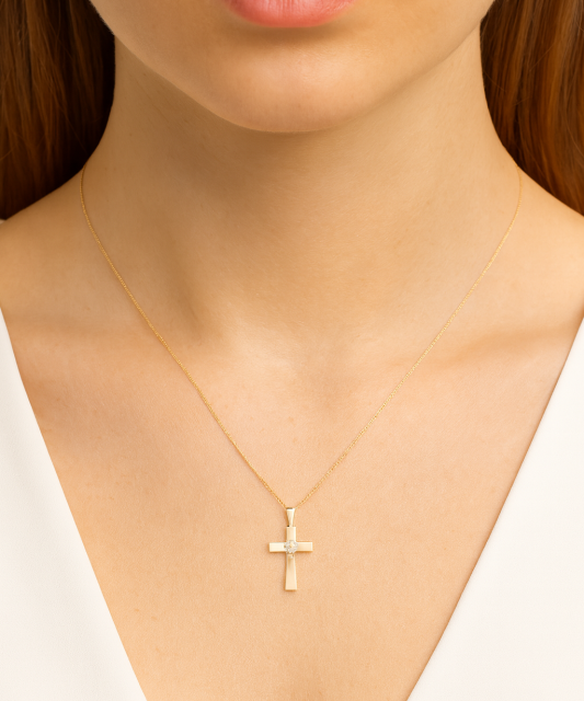 Gold pendant with diamond "cross"