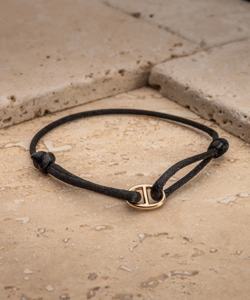 Black string bracelet with gold
