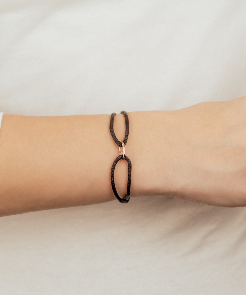 Black string bracelet with gold