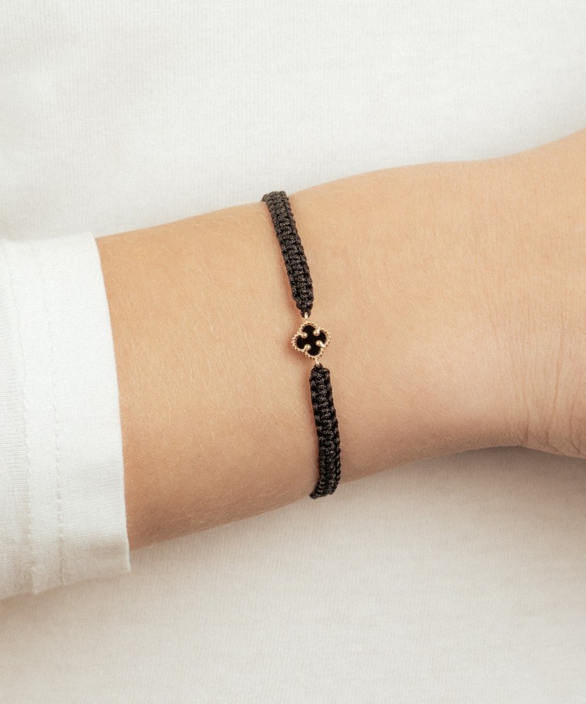 Black string bracelet with gold and onyxes